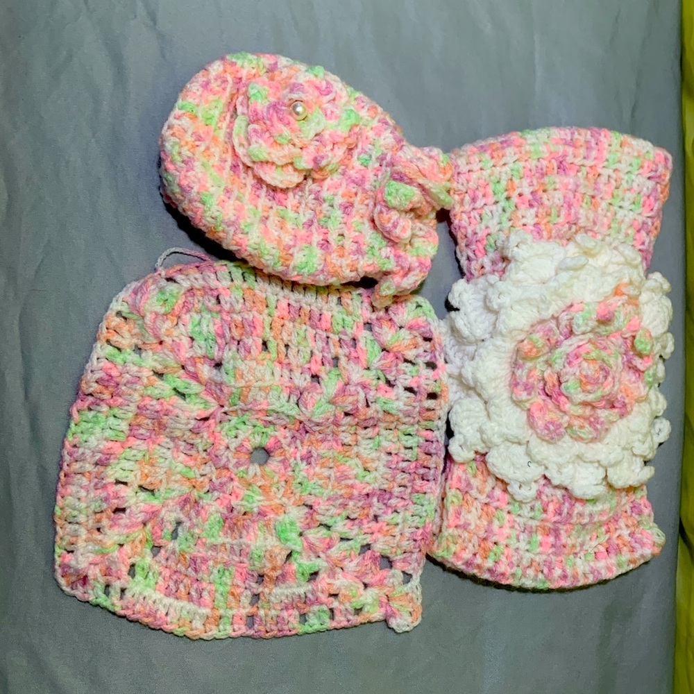 I am selling a pinkish color purse, bow, and little tiny blanket.